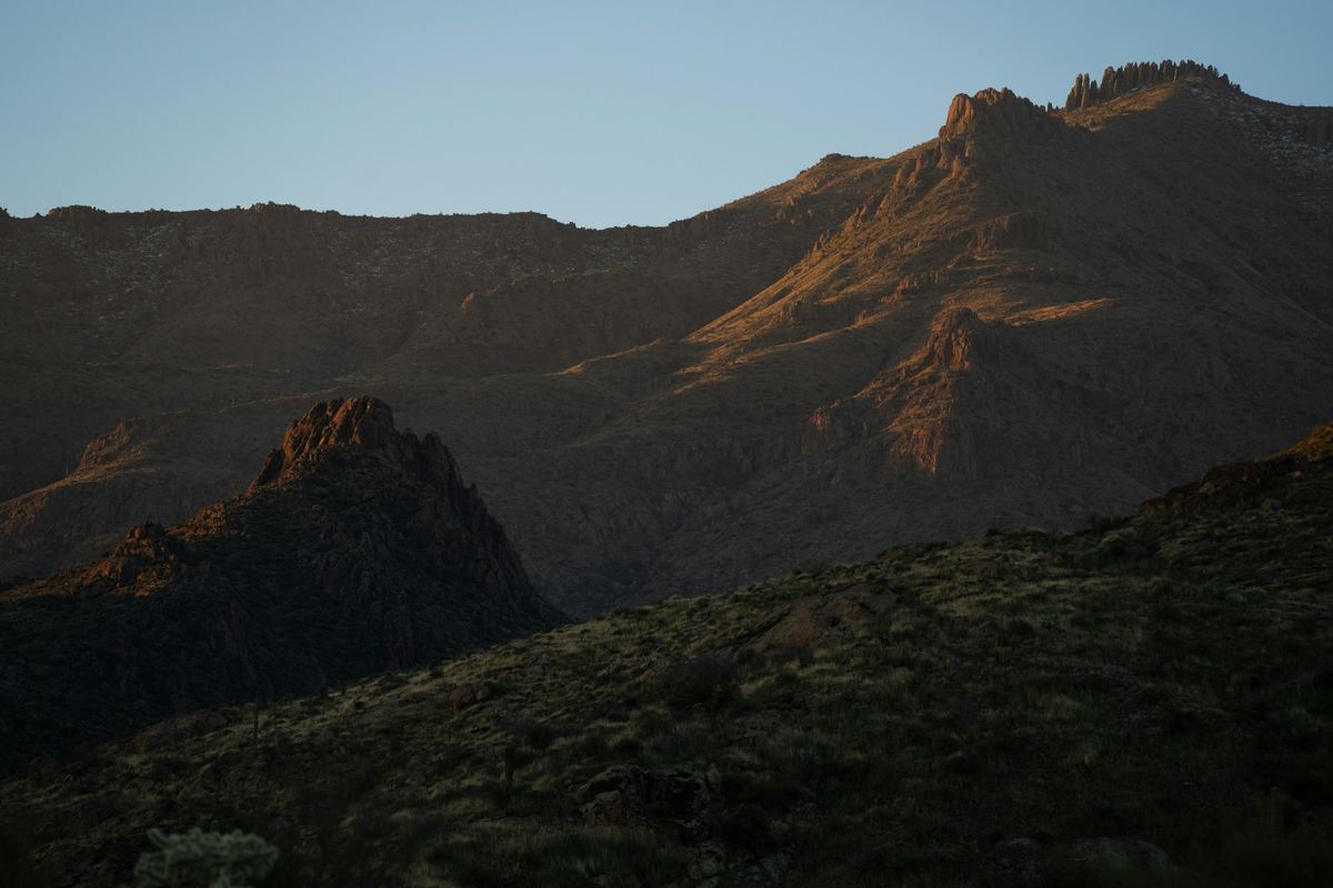 Rugged Arizona desert mountains catching the last light of sunset